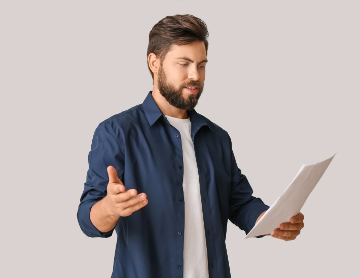 Man practicing role-play training exercise with a script in hand