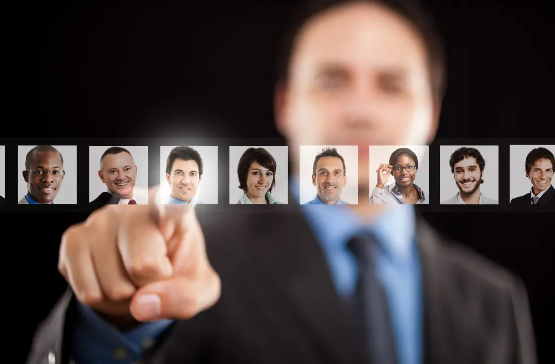 Man in business suit selecting a virtual candidate profile.