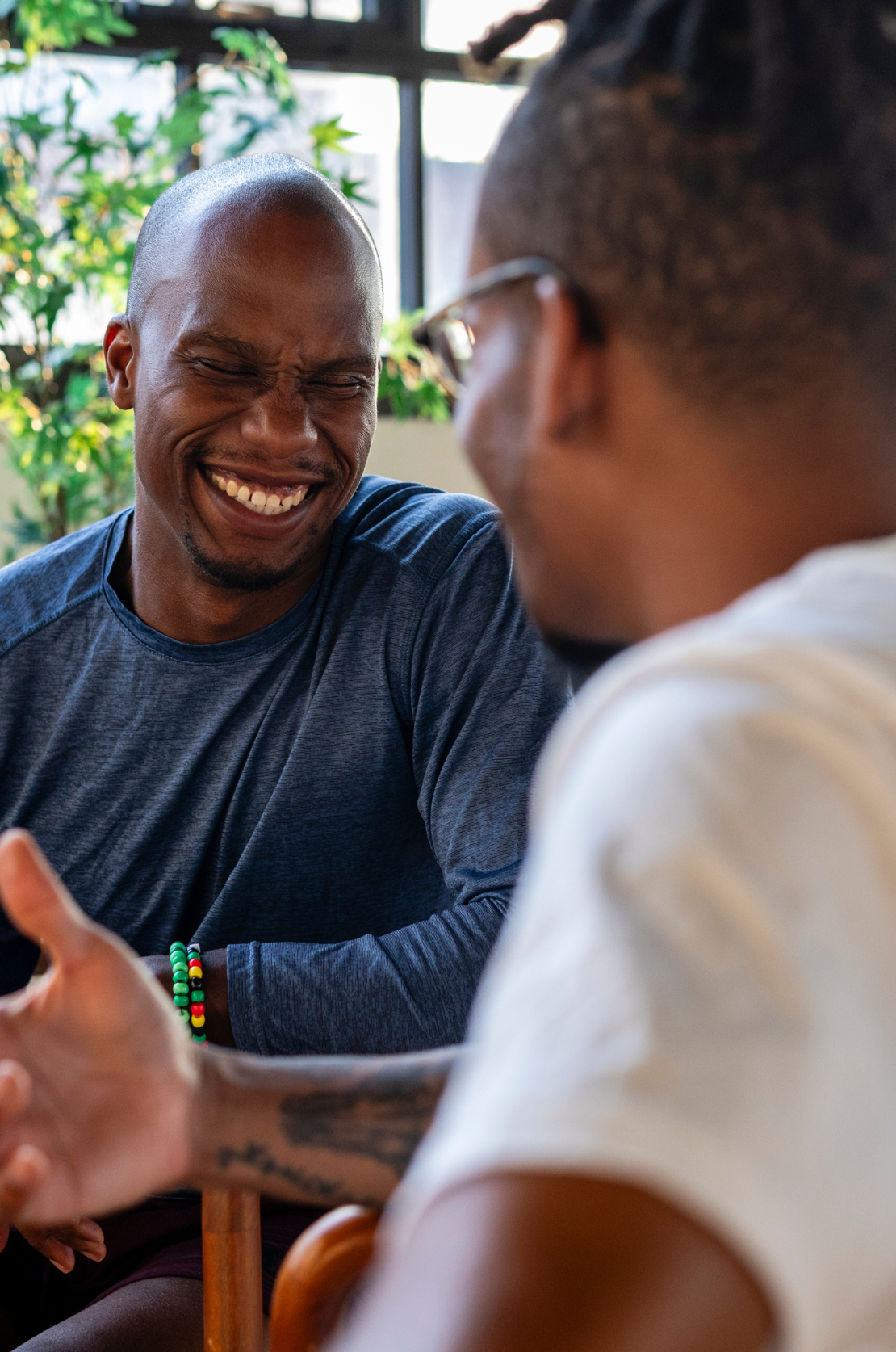 Two men in a supportive conversation, building trust through open and empathetic dialogue
