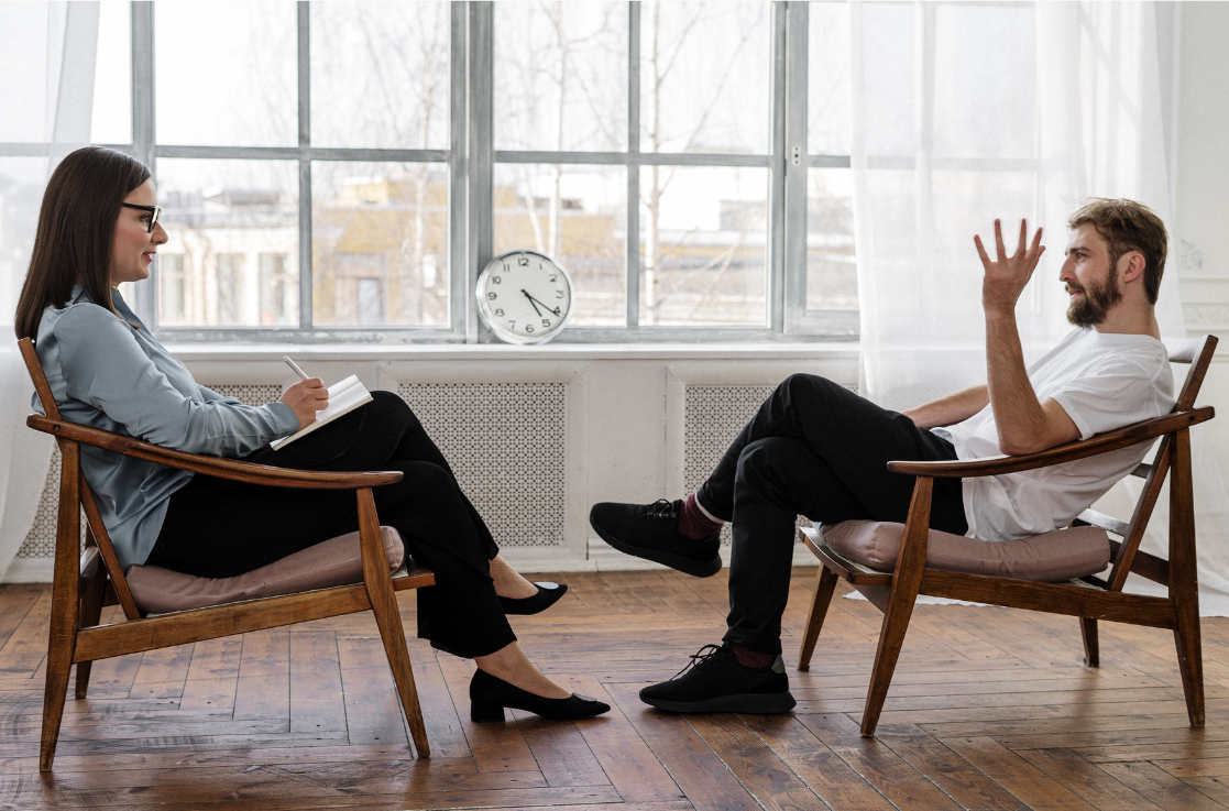 Therapist attentively listening to a client during a private counseling session