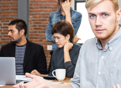 Frustrated team experiencing communication breakdown in a meeting