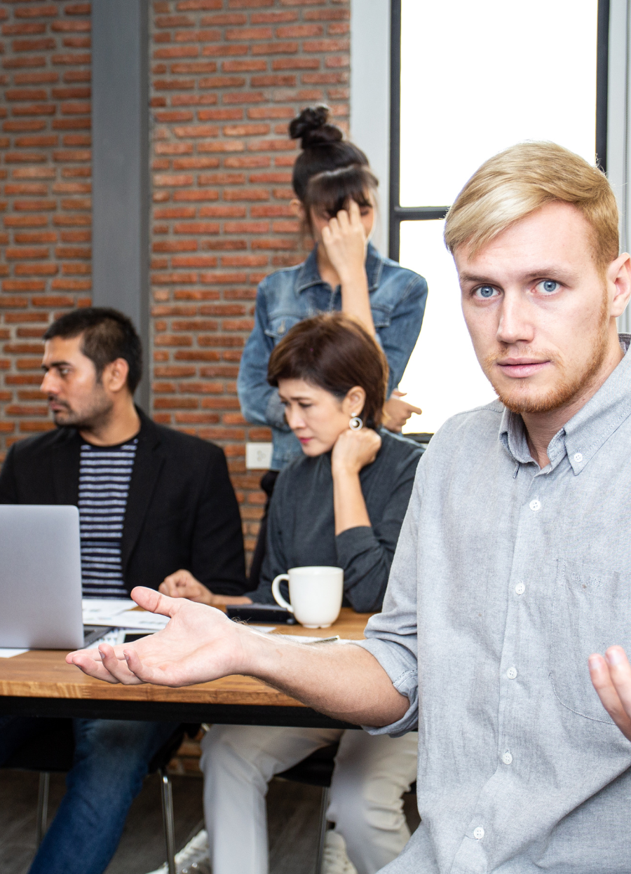 Frustrated team experiencing communication breakdown in a meeting