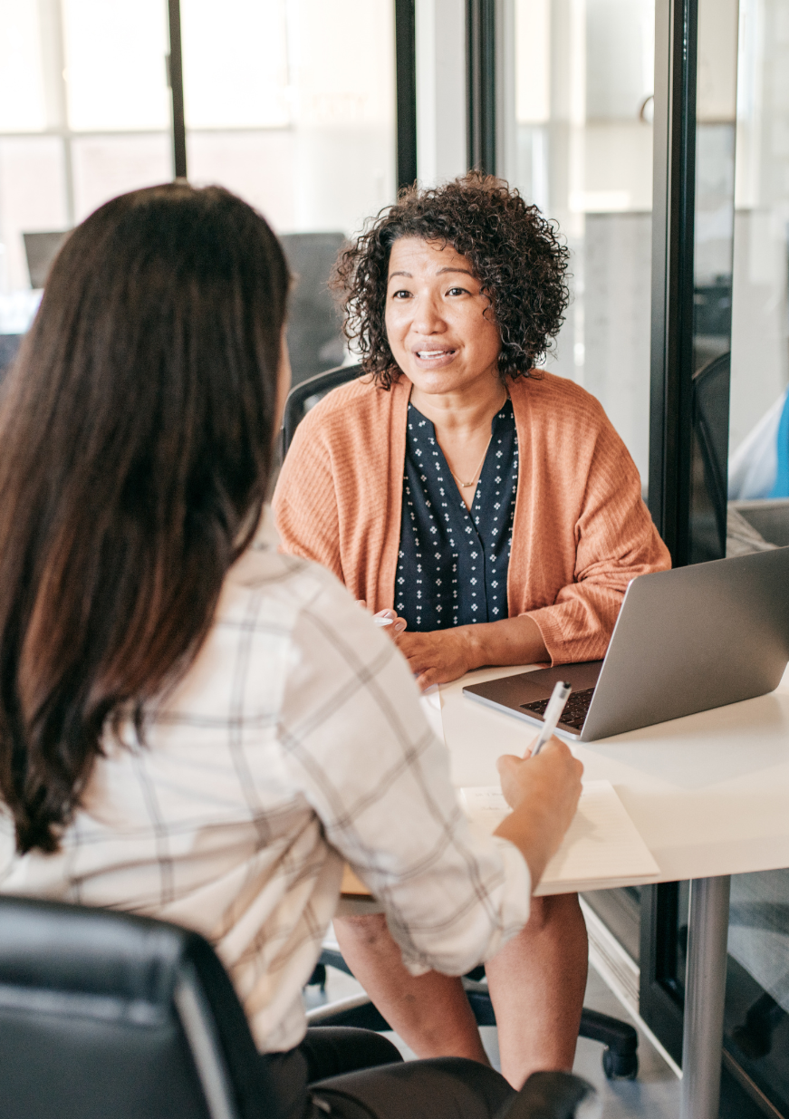 Professional woman attentively listening to a candidate during a job interview