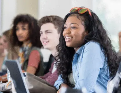 Engaged student smiling during an interactive learning session